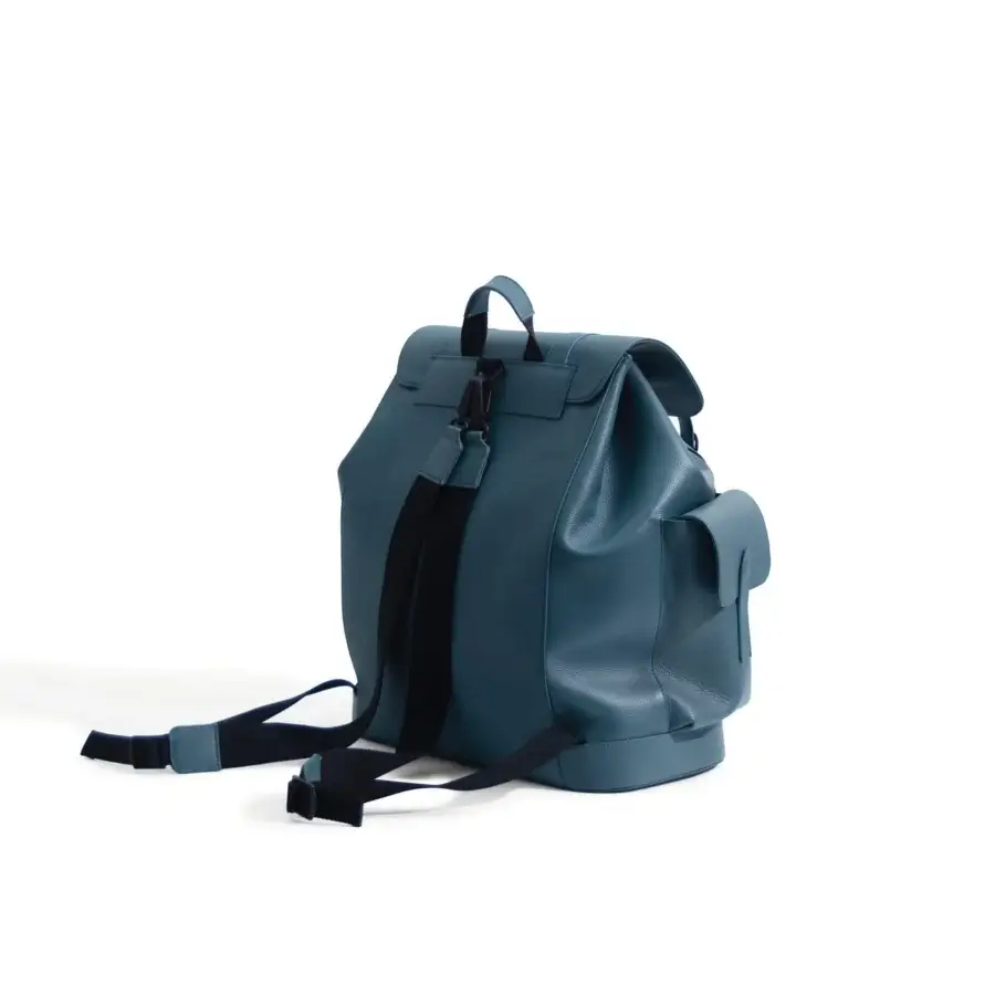 Distinguished Mascheroni Biggie backpack crafted in Italy from supple black leather with a muted teal blue hue and flap closure