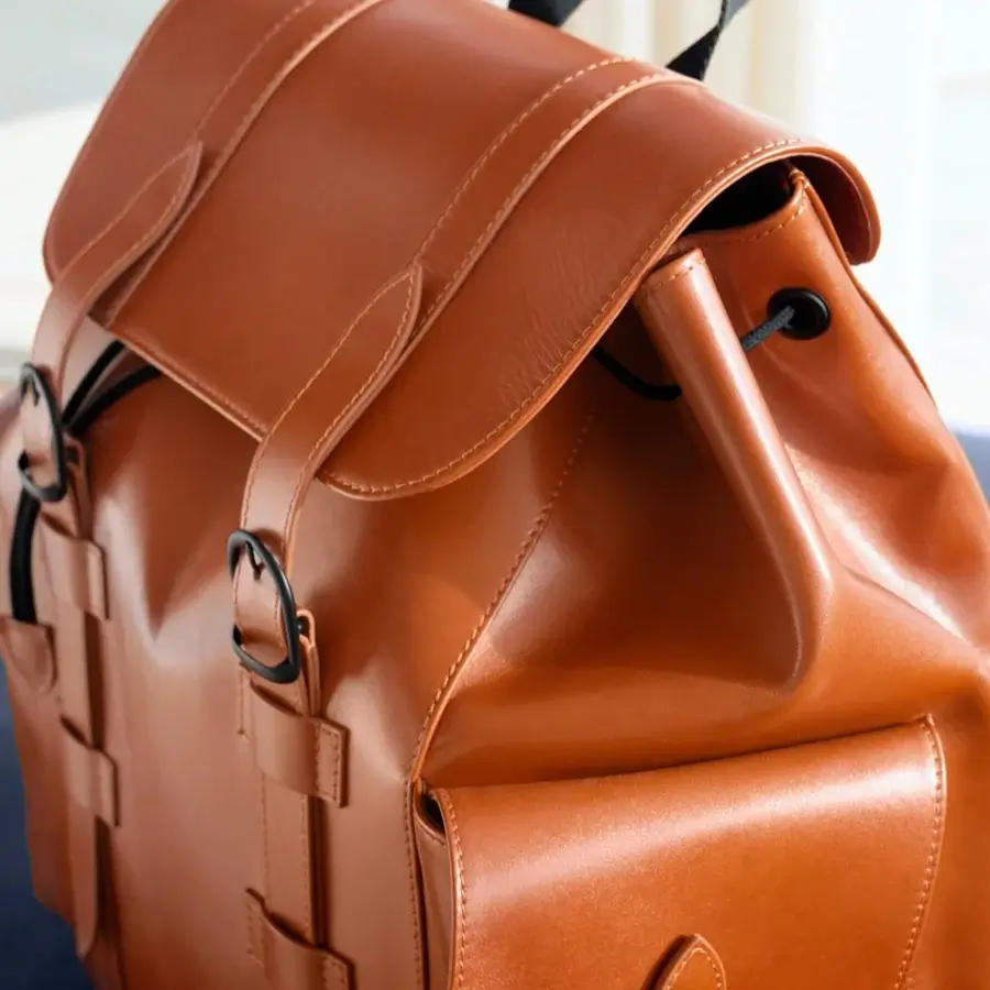 Superior Mascheroni Biggie backpack in smooth medium-brown leather with dark brown detailing and sleek black hardware