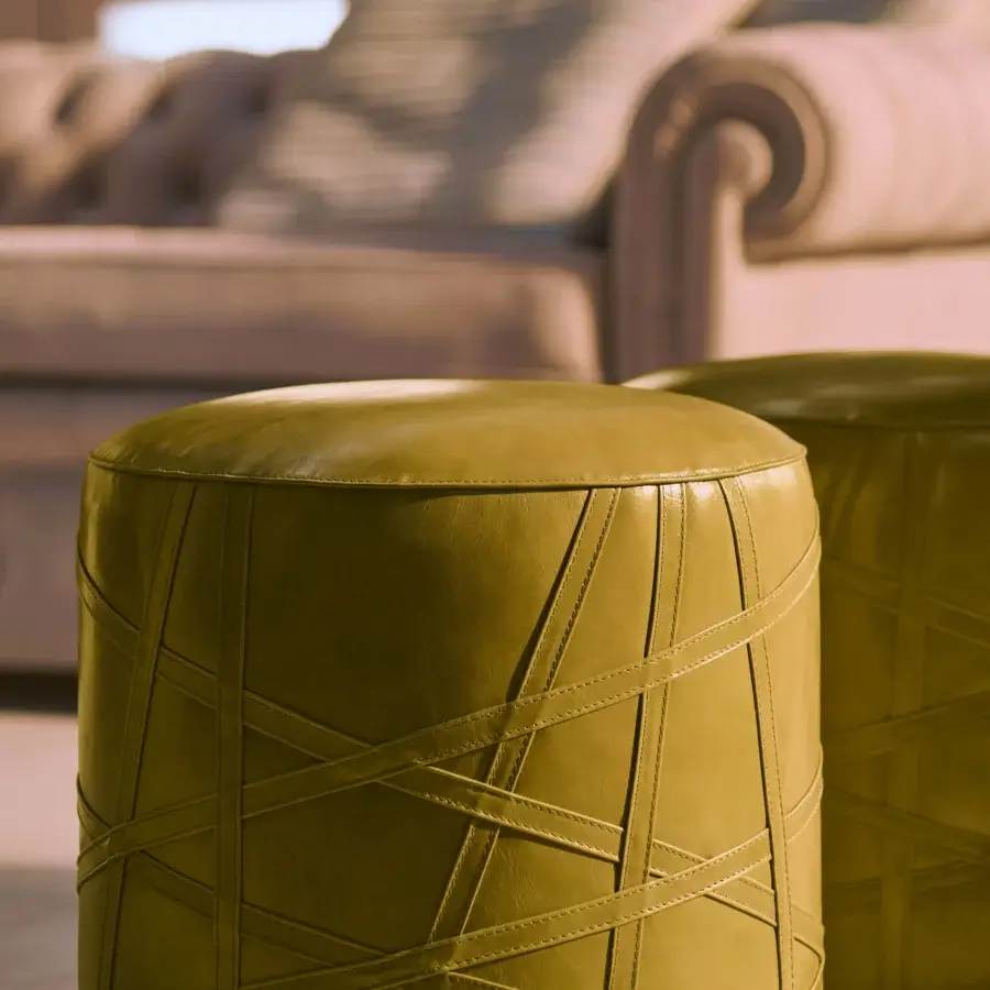 Superior Mascheroni San Lorenzo ottoman in muted olive green leather with geometric stitched lines and curved birch structure