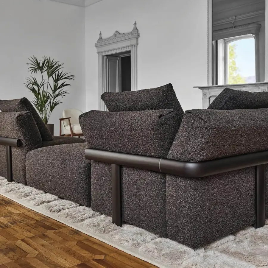 Lavish Porada Ronny sectional with dark gray textured textile upholstery and matte dark-toned metal base