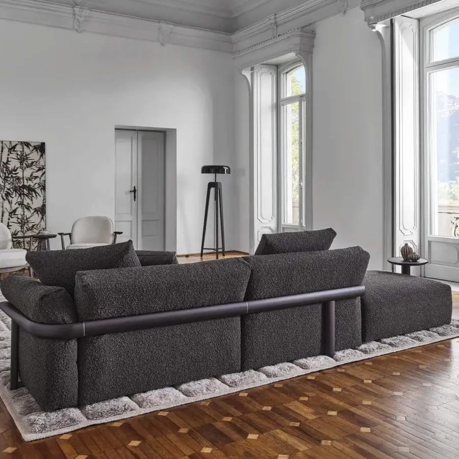 Distinguished Porada Ronny sectional with dark gray textured textile upholstery and sleek base band construction