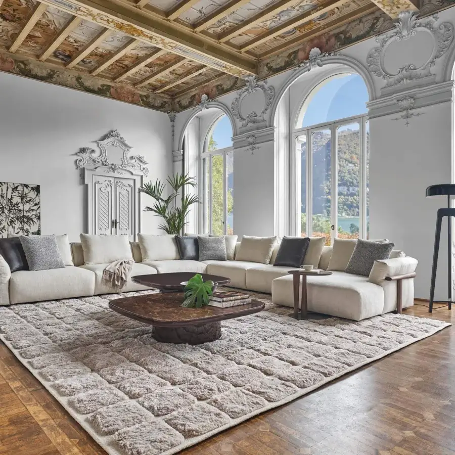 Exceptional Porada Ronny sectional with off-white textile upholstery and quilted 100% goose down encased in a woven cotton shell