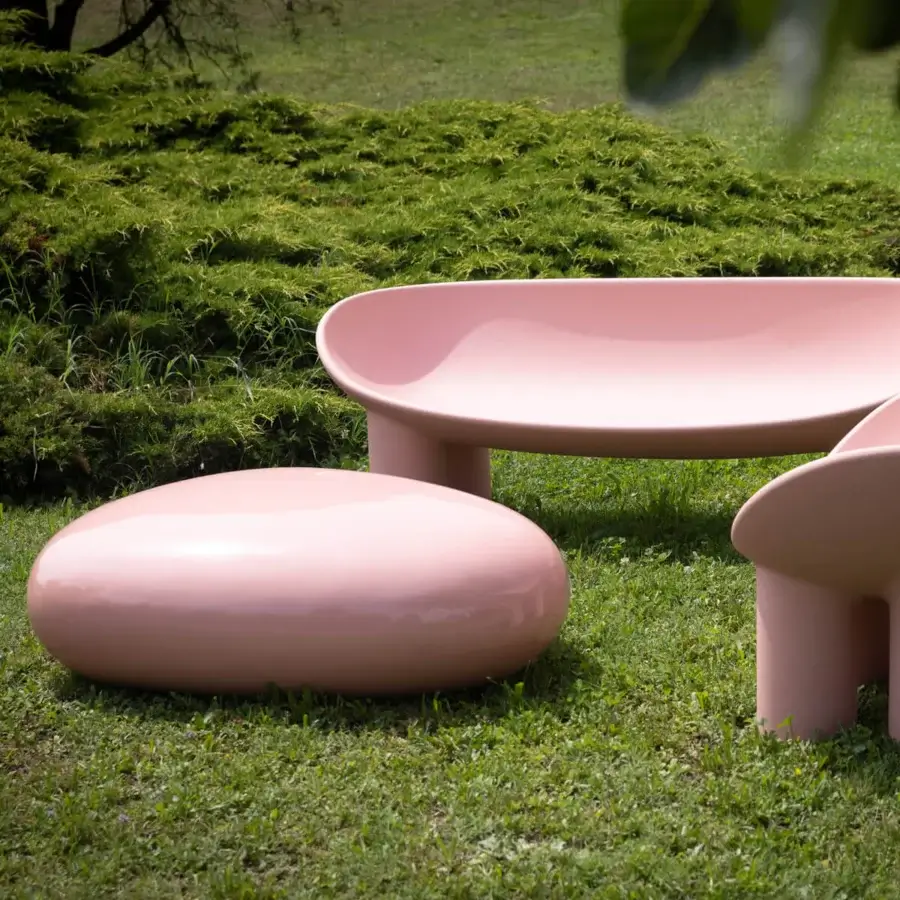 Superior Driade Koishi ottoman crafted from painted fiberglass in a muted pink with a glossy finish