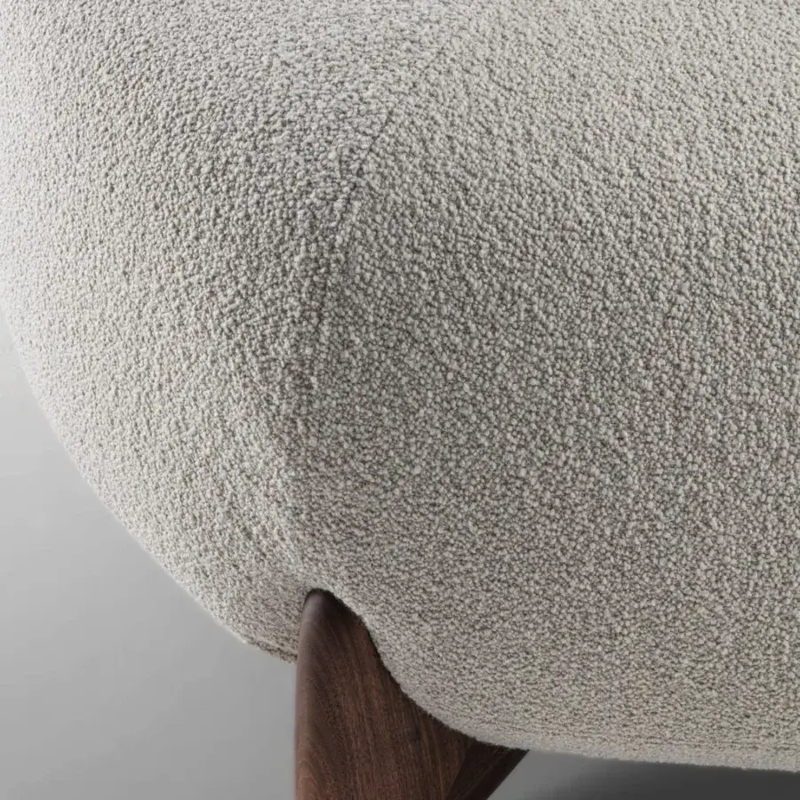 Distinguished Porada Softbay ottoman with looped-pile light beige textile upholstery and satin medium-brown wood leg