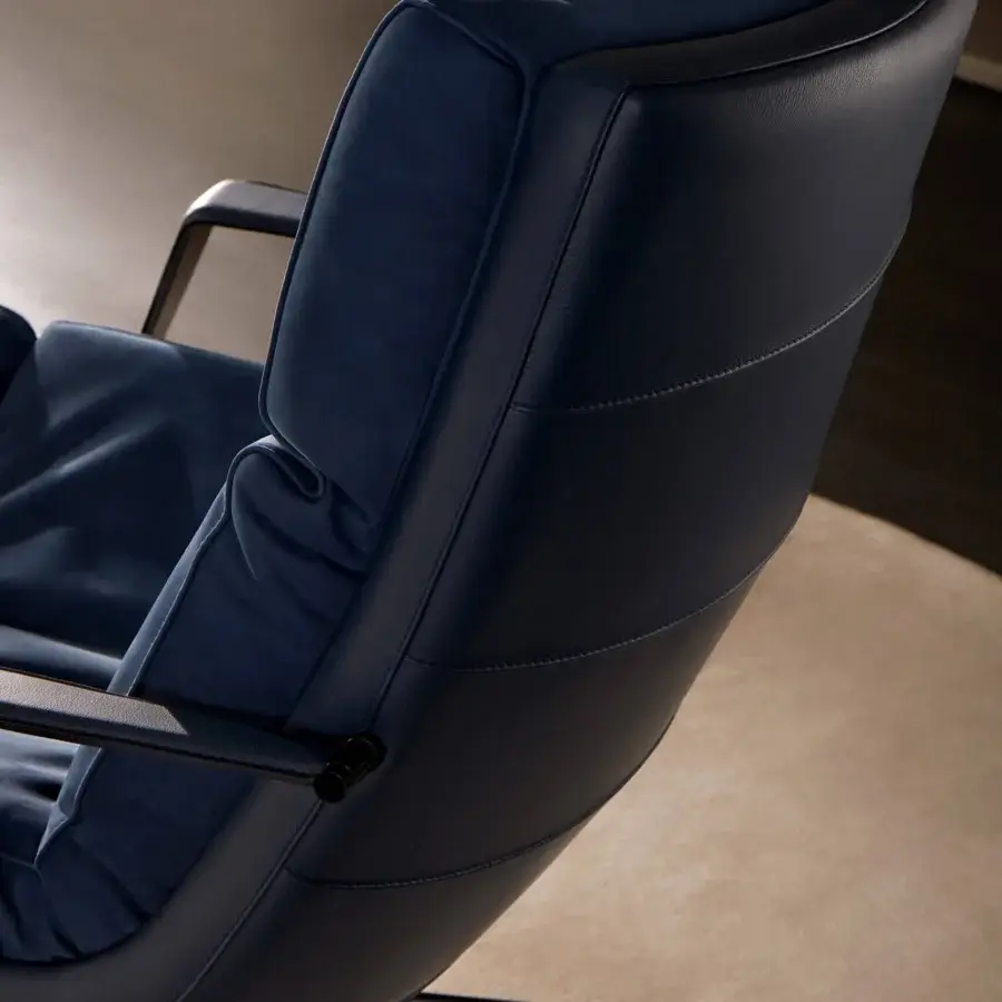 Distinguished Mascheroni Cabrio lounge chair in deep blue nubuck and vegetable leather with quilted stitching and matte black metal base
