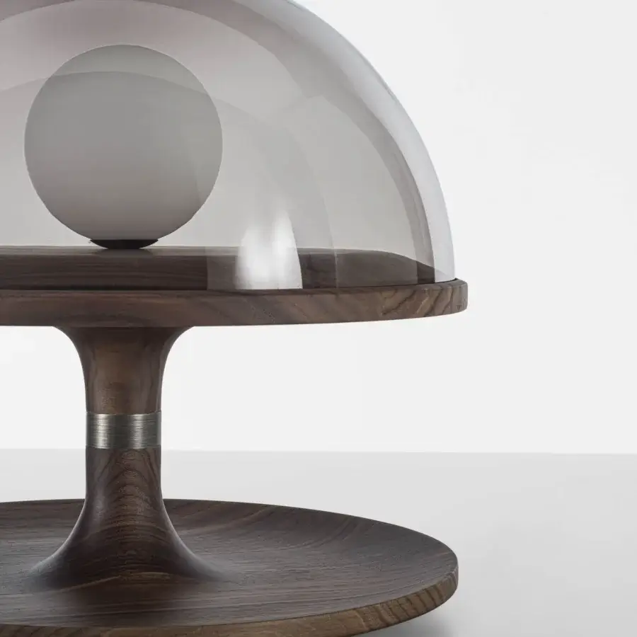 Superior Porada Tack table lamp crafted in Canaletta walnut with bronzed brass accents and a smoked transparent glass diffuser