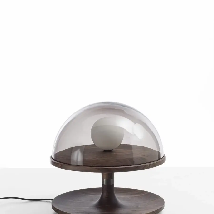 Elegant Porada Tack table lamp crafted in Canaletta walnut with bronzed brass accents and a smoked transparent glass diffuser