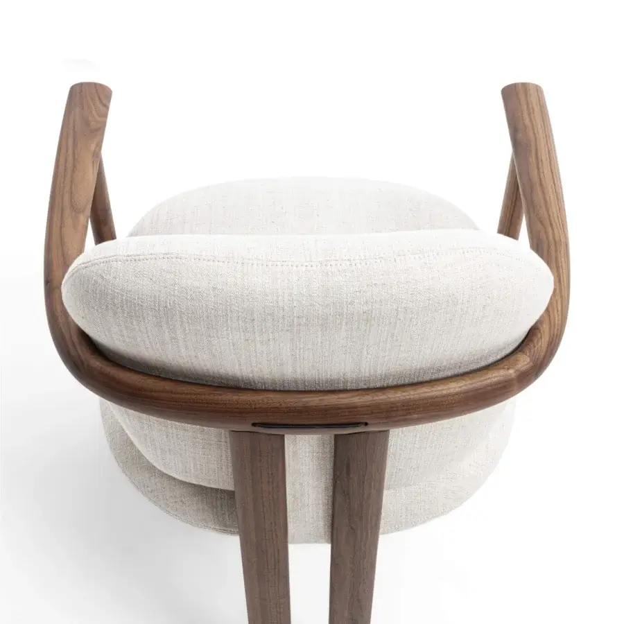 Exceptional Porada Teti chair crafted in medium-dark wood with satin finish and light beige upholstered cushions secured with saddle leather cord