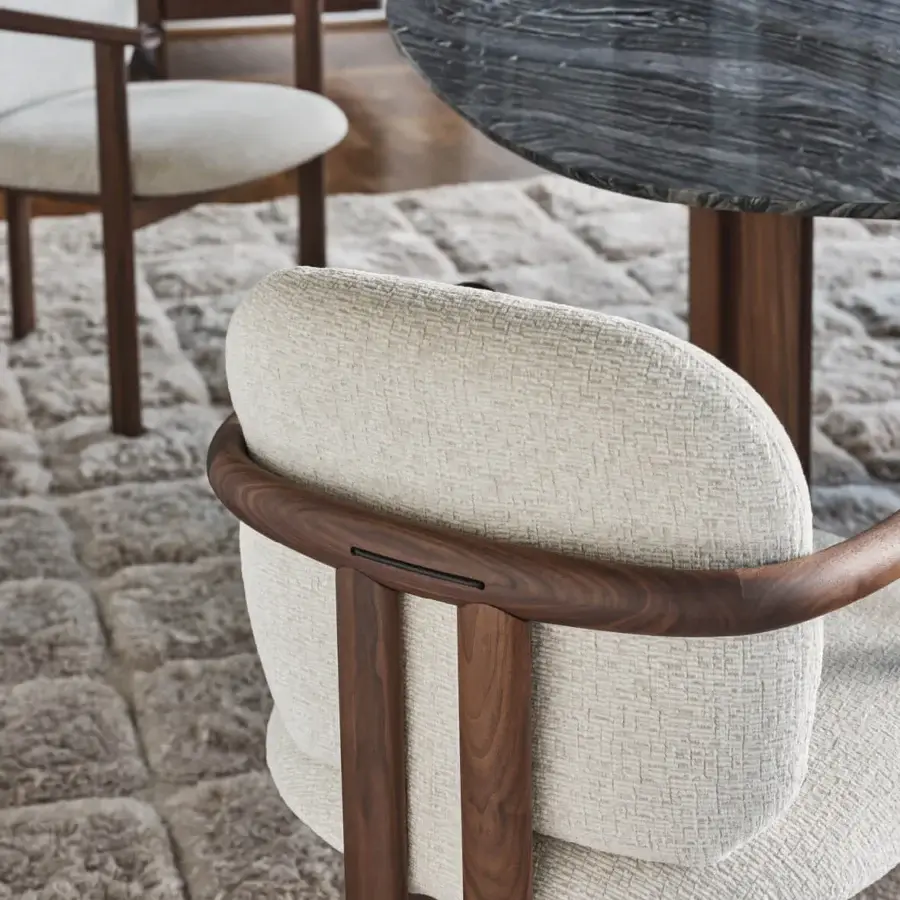 Elegant Porada Teti chair in solid wood with satin finish and neutral beige upholstery featuring saddle leather cord