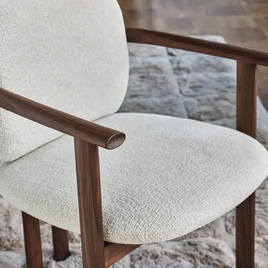 Exceptional Porada Teti chair crafted in solid wood with satin finish and off-white textile upholstery secured with saddle leather cord