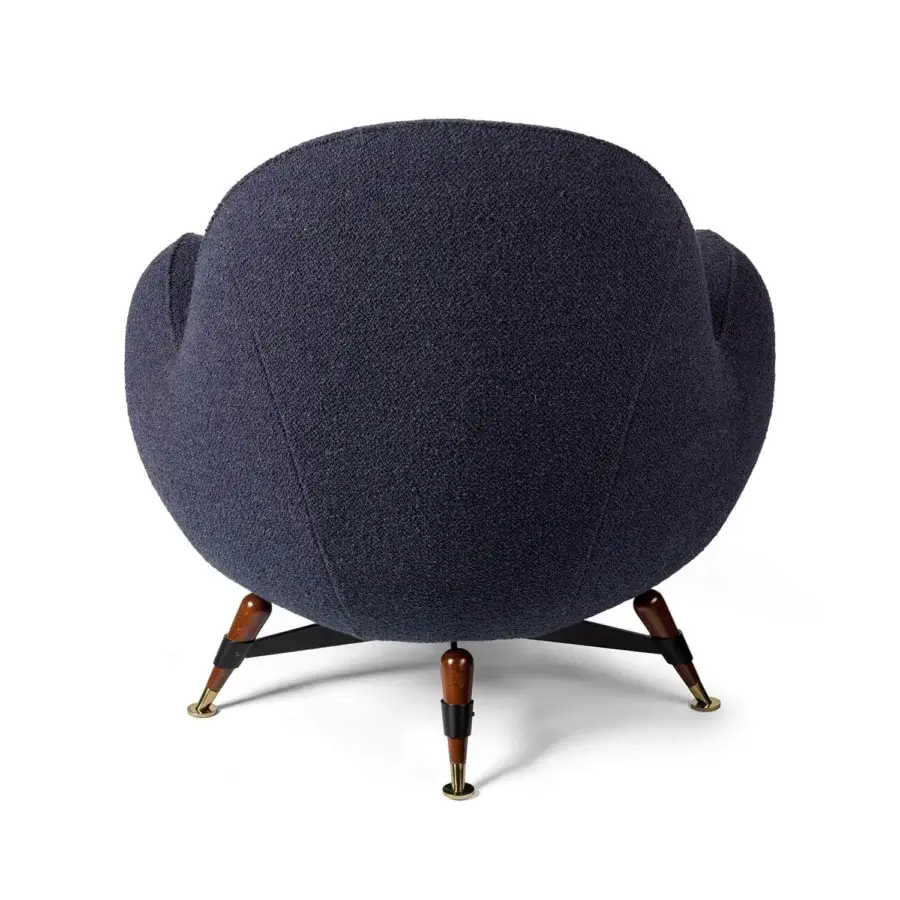 Exceptional Visionnaire Mercury lounge chair with rounded form in deeply textured navy blue textile upholstery and lacquered brass tips