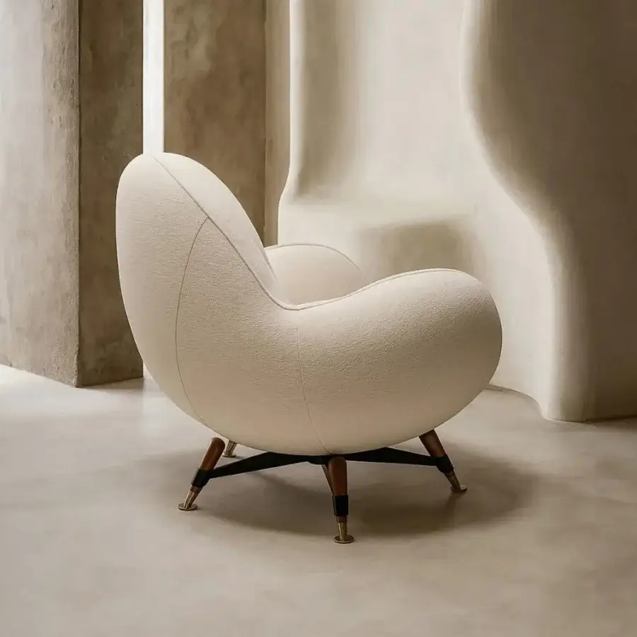 Superior Visionnaire Mercury lounge chair with textured cream fabric upholstery and polished brass tipped solid wood legs