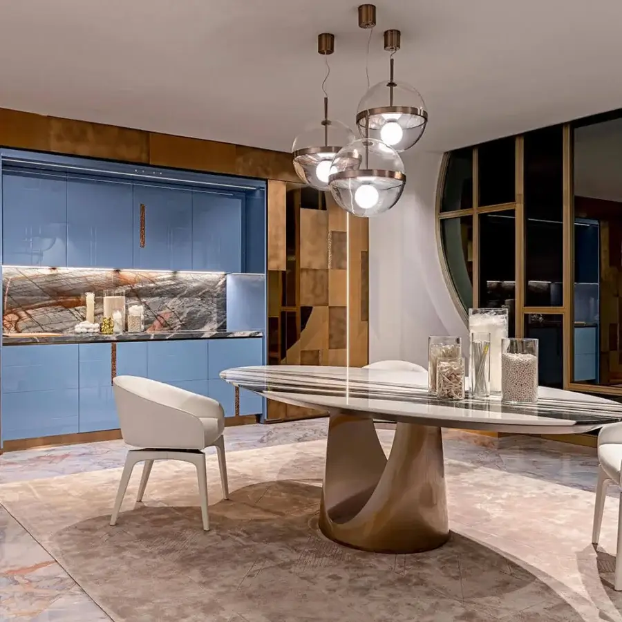Superior Visionnaire Cameron table built with carved marble, polished stainless steel, and lacquered wooden under-top