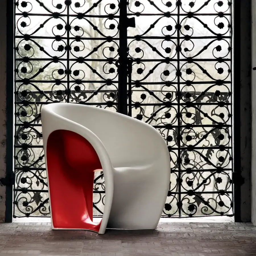 Innovative Driade MT1 lounge chair crafted in glossy sand white polyethylene revealing a vibrant red interior