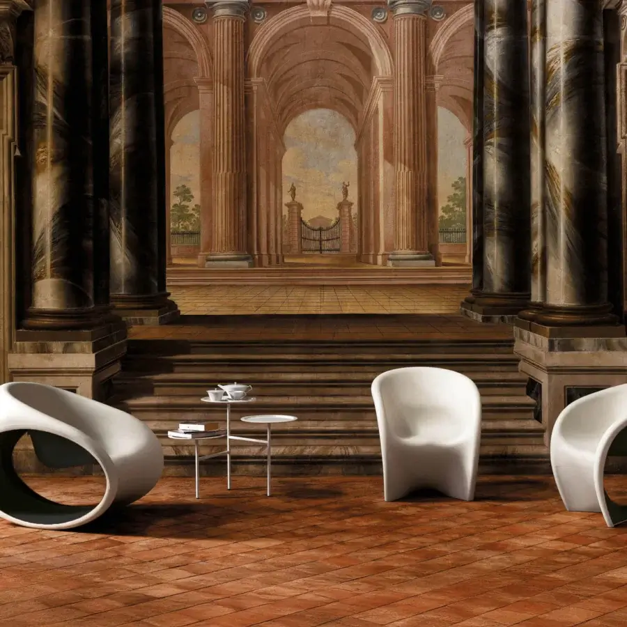 Exceptional Driade MT1 lounge chair molded in polyethylene with a matte finish, showcasing sand white exterior and vibrant red interior