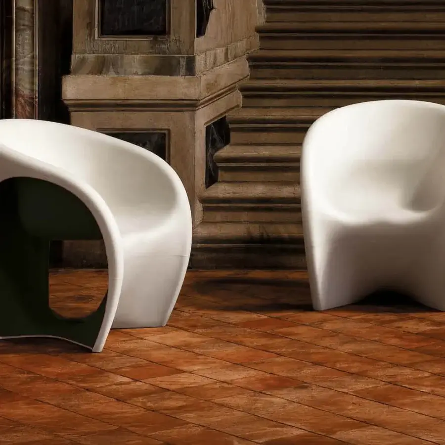 Elegant Driade MT1 lounge chair molded in sand white polyethylene with a deep black interior and matte finish