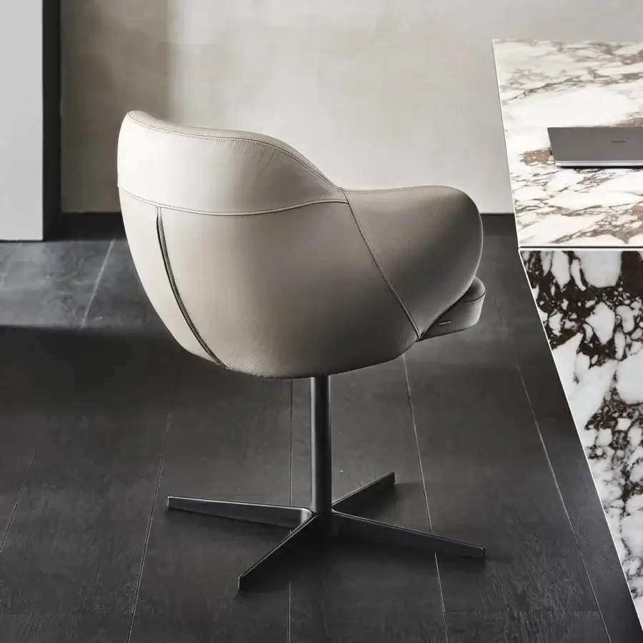 Elegant Cattelan Italia Bombè X armchair with light gray soft leather upholstery and embossed lacquered steel base
