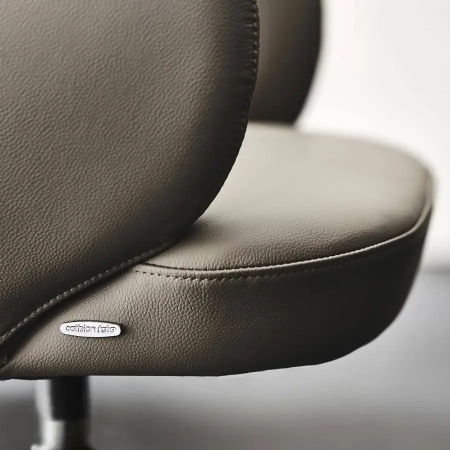 Distinguished Cattelan Italia Bombè X armchair with soft leather upholstery and embossed lacquered steel base in a matte finish