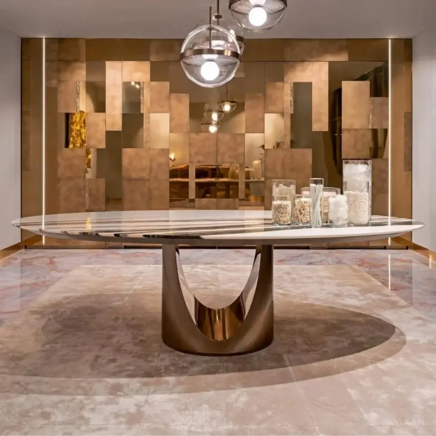 Exceptional Visionnaire Cameron table crafted in steel with bronze finish and cool grey marble tabletop
