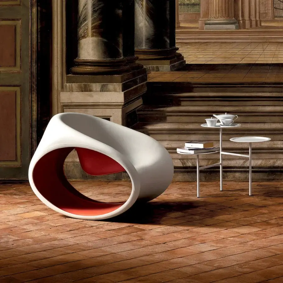 Captivating Driade MT3 rocking lounge chair with sand white polyethylene monoblock and reddish-orange interior revealing a smooth matte finish