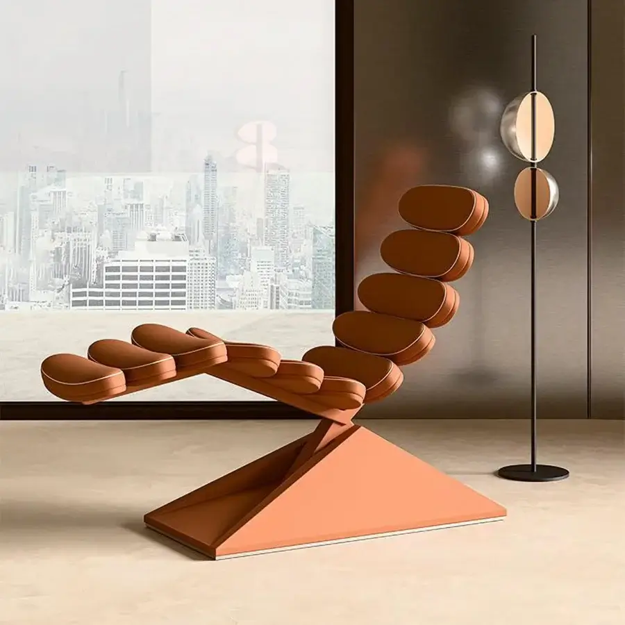 Lavish Mascheroni Concorde lounge chair built with supple leather shells and a sleek triangular base in warm orange-brown hues