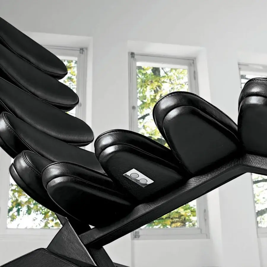 Exceptional Mascheroni Concorde lounge chair built with smooth dark leather shells and sculpted birch wood framing