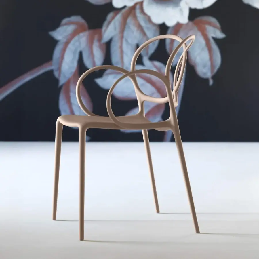Elegant Driade Sissi chair molded from glass fiber reinforced copolymer in warm beige with smooth matte finish