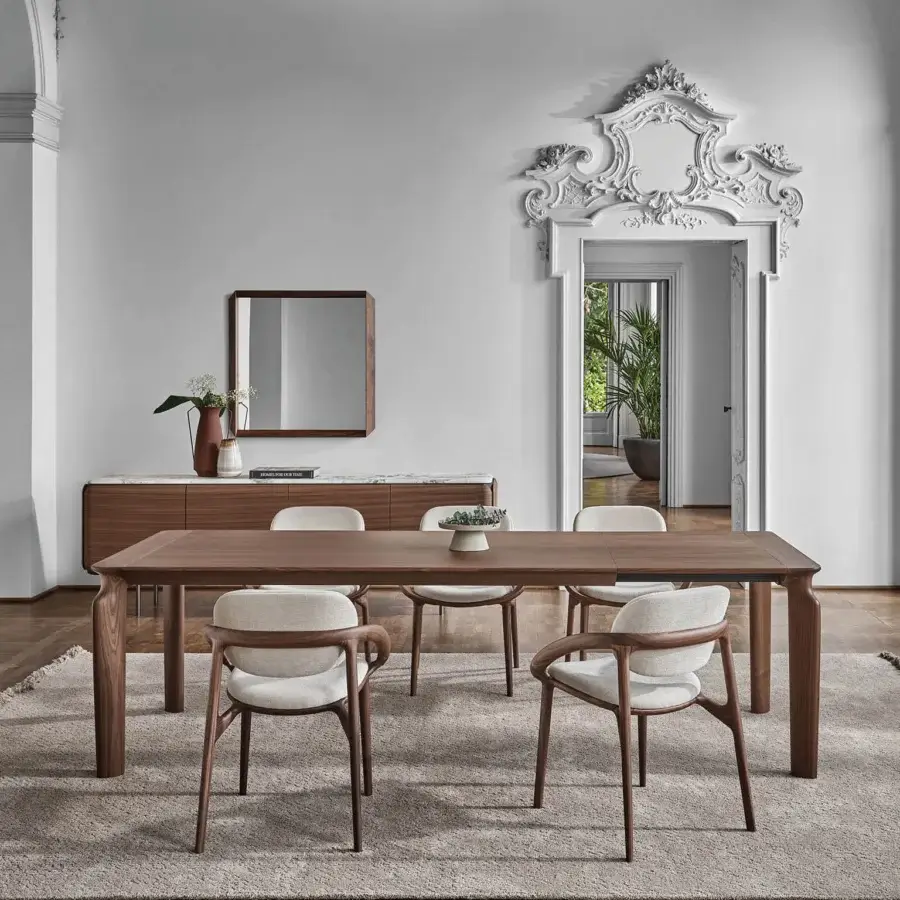 Distinguished Porada Amphora extendable table crafted in Canaletta walnut with a smooth satin finish presents a minimalist aesthetic