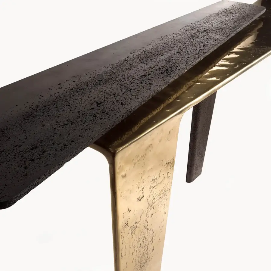 Distinguished Visionnaire Lego console built with eroded matte black concrete and hand-polished, sand-cast golden aluminum support