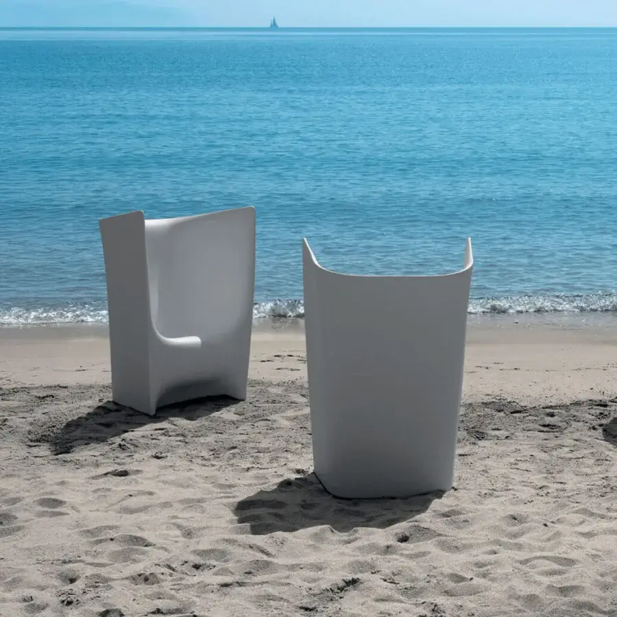 Elegant Driade Pliè lounge chair crafted with durable polyethylene in a light gray matte finish offers a cocoon-like seating experience