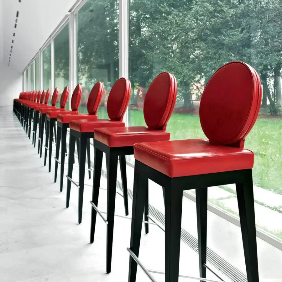 Superior Mascheroni Martini bar stool with red ox leather seat and organically curved shaped birch frame crafted in Italy