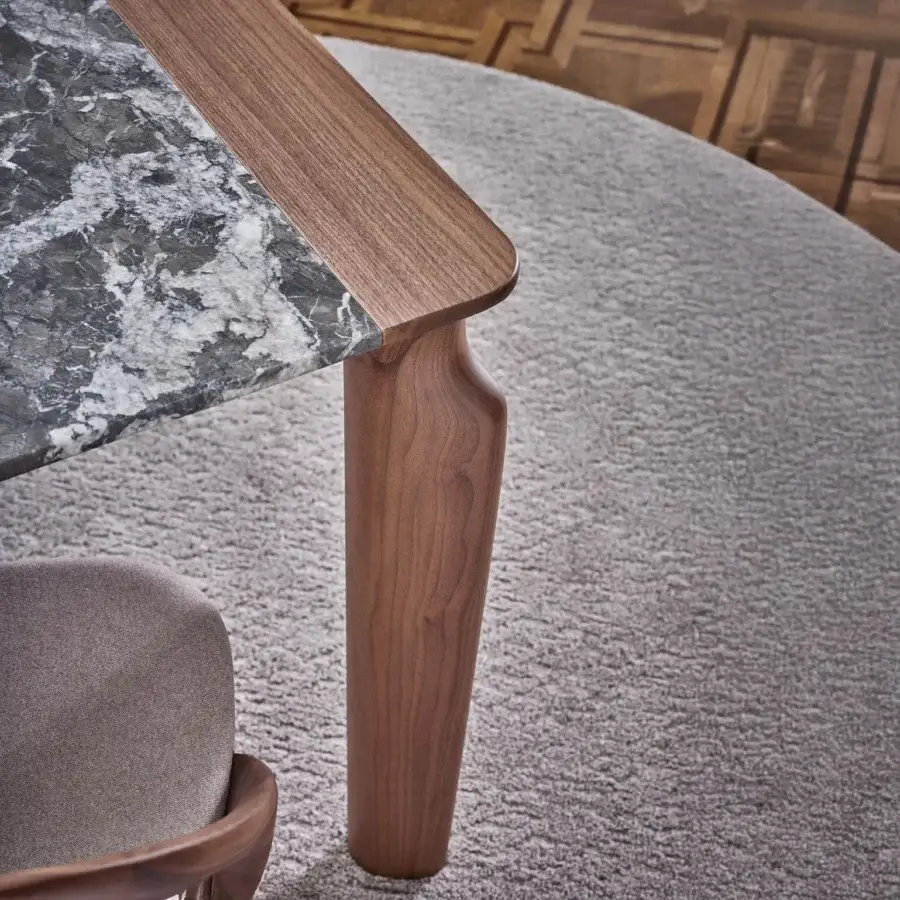 Distinguished Porada Amphora table crafted with solid Canaletta walnut and dark gray marble with a satin finish