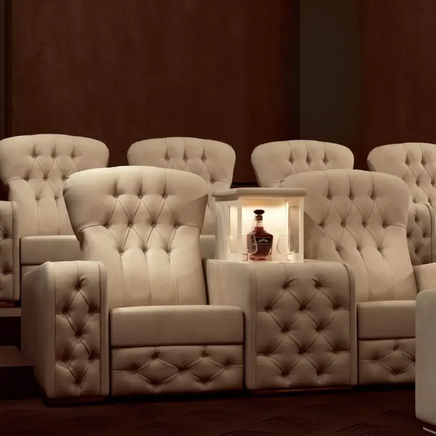 Exceptional Vismara Chest home cinema seating in light beige quilted fabric with glossy lacquered wood side tables and chrome steel cupholders