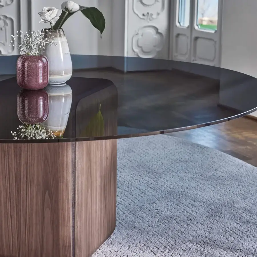 Elegant Porada Bay round table with a substantial glass top and solid Canaletta walnut hexagonal base in satin finish