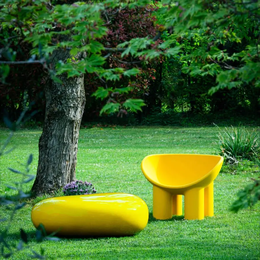 Elegant Driade Roly Poly lounge chair with enveloping seat crafted in vibrant yellow polyethylene monoblock