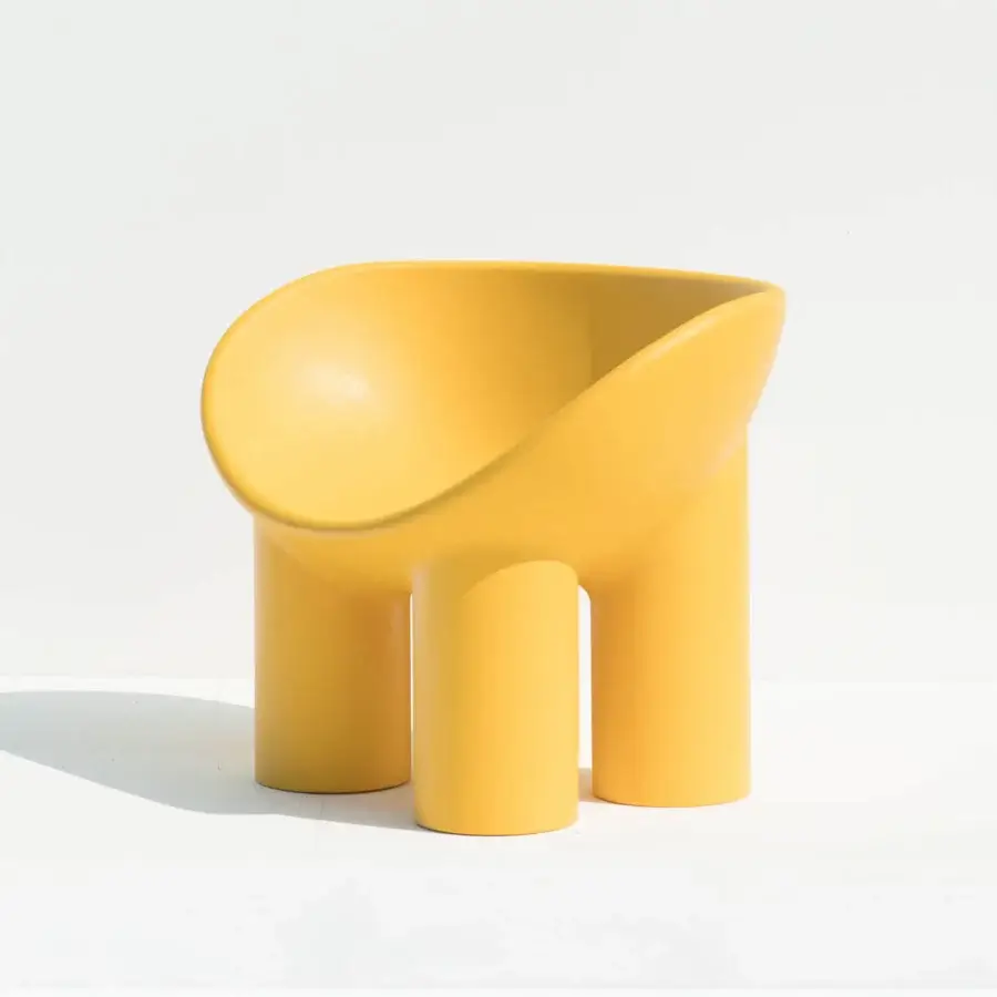 Exclusive Driade Roly Poly lounge chair with rounded silhouette crafted in warm yellow polyethylene and matte finish