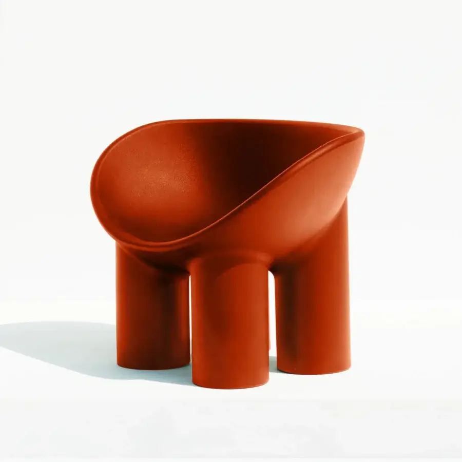 Distinguished Driade Roly Poly lounge chair with enveloping form molded in terracotta polyethylene and uniformly matte finish