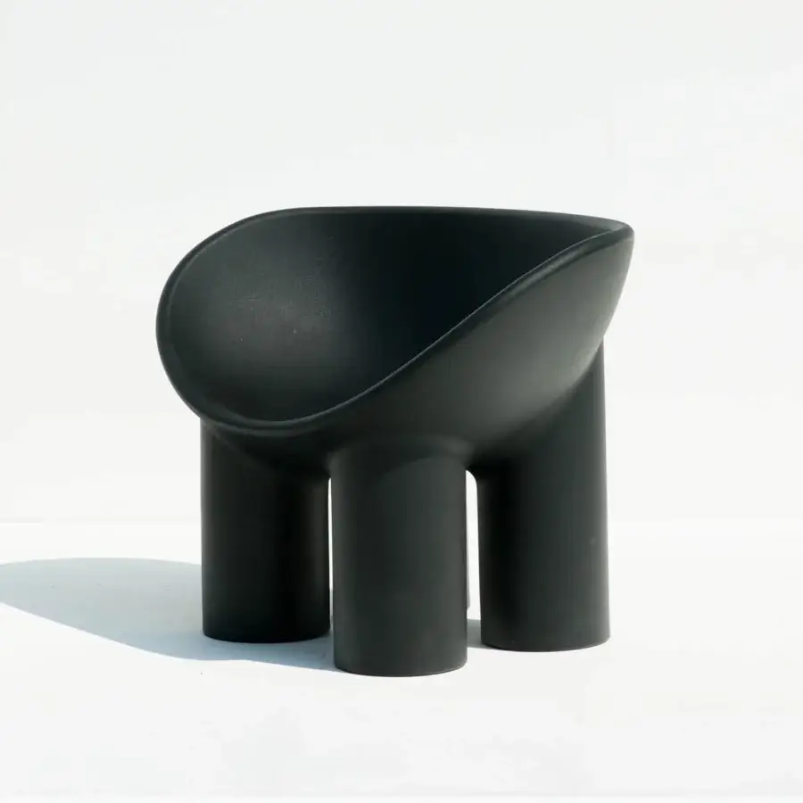 Sophisticated Driade Roly Poly lounge chair with playfully architectural form molded in charcoal polyethylene and matte finish