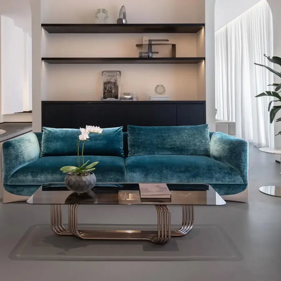 Harmonious Visionnaire Ca’ Foscari sofa with plush deep teal textile upholstery and polished steel base