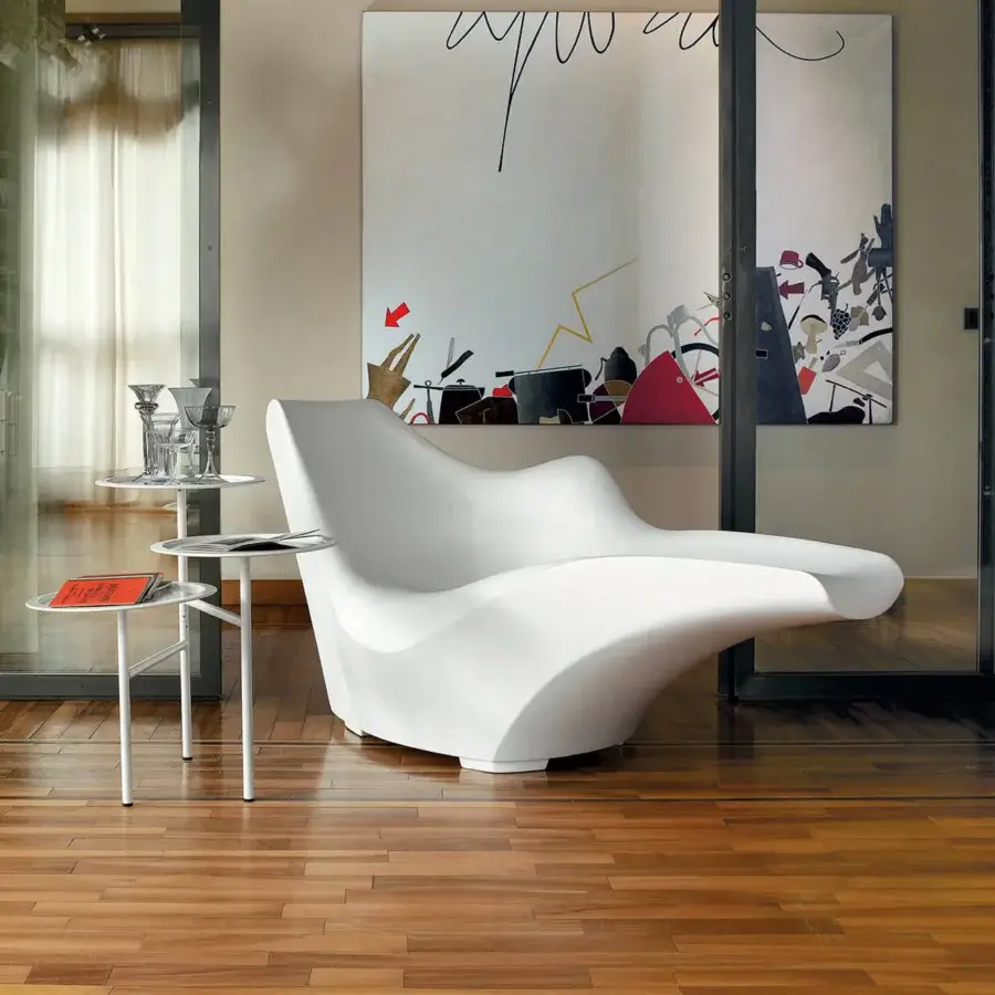 Innovative Driade Tokyo-Pop chaise lounge in white polyethylene with a smooth matte finish and asymmetrical lines