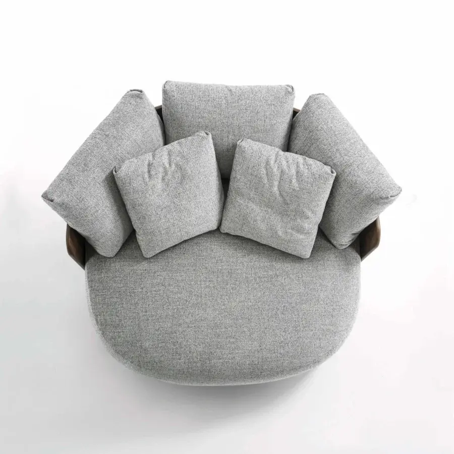 Lavish Porada Calin XL lounge chair built with curved Canaletta walnut and plush light gray textile upholstery with a subtle speckled finish