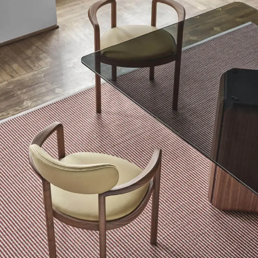 Sophisticated Porada Dione chair reimagines a bucket seat crafted with canaletta walnut and muted beige textile upholstery with a satin finish