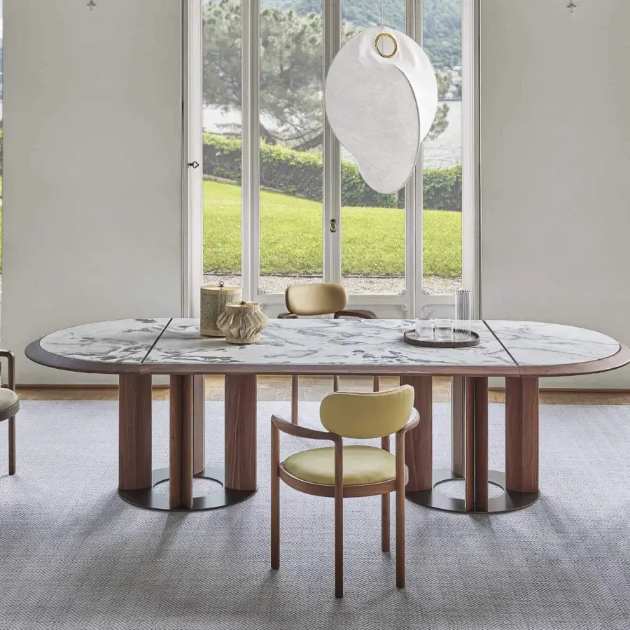 Distinguished Porada Dione chair reimagines a bucket seat crafted with solid canaletta walnut and pale yellow textile upholstery with a satin finish