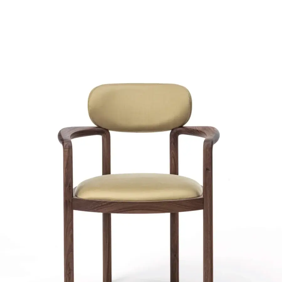 Exceptional Porada Dione chair reimagines a bucket seat crafted with solid canaletta walnut and golden-beige upholstery with a satin finish