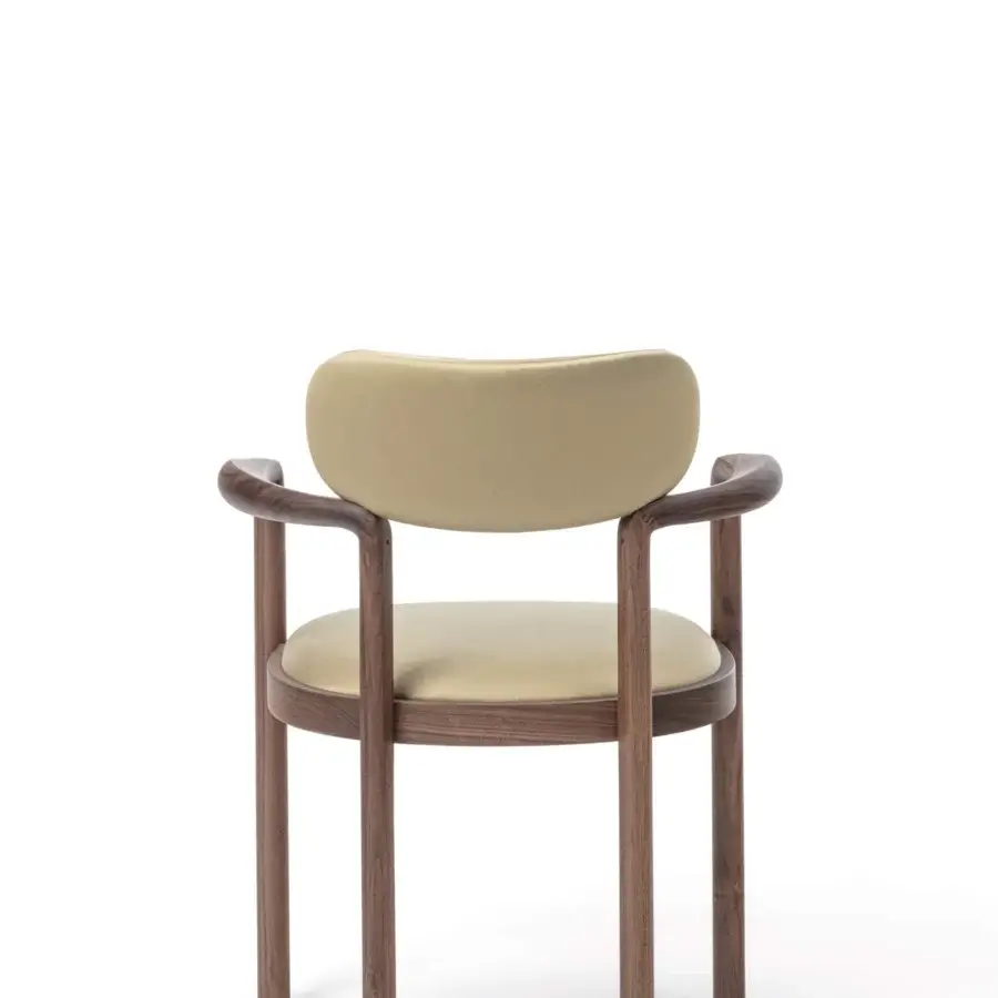 Superior Porada Dione chair reimagines a bucket seat crafted with solid canaletta walnut and muted olive green upholstery with a satin finish