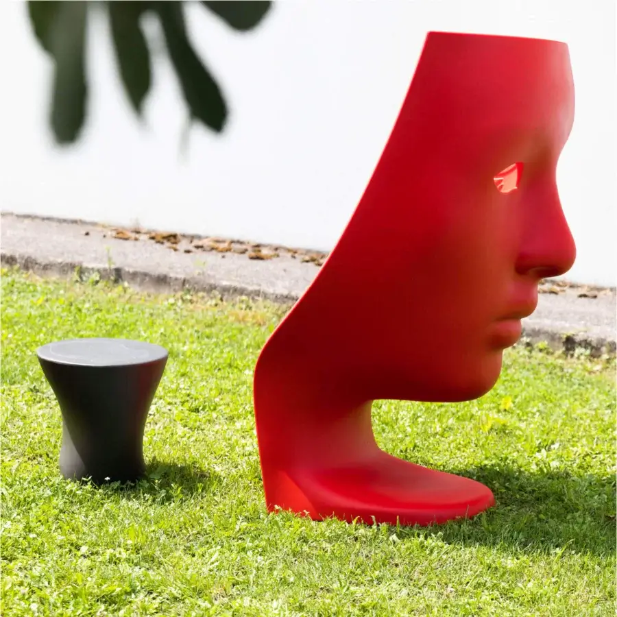 Avant-garde Driade Nemo Lounge chair sculpted from glossy red polyethylene presents a contemporary form inspired by a classical head