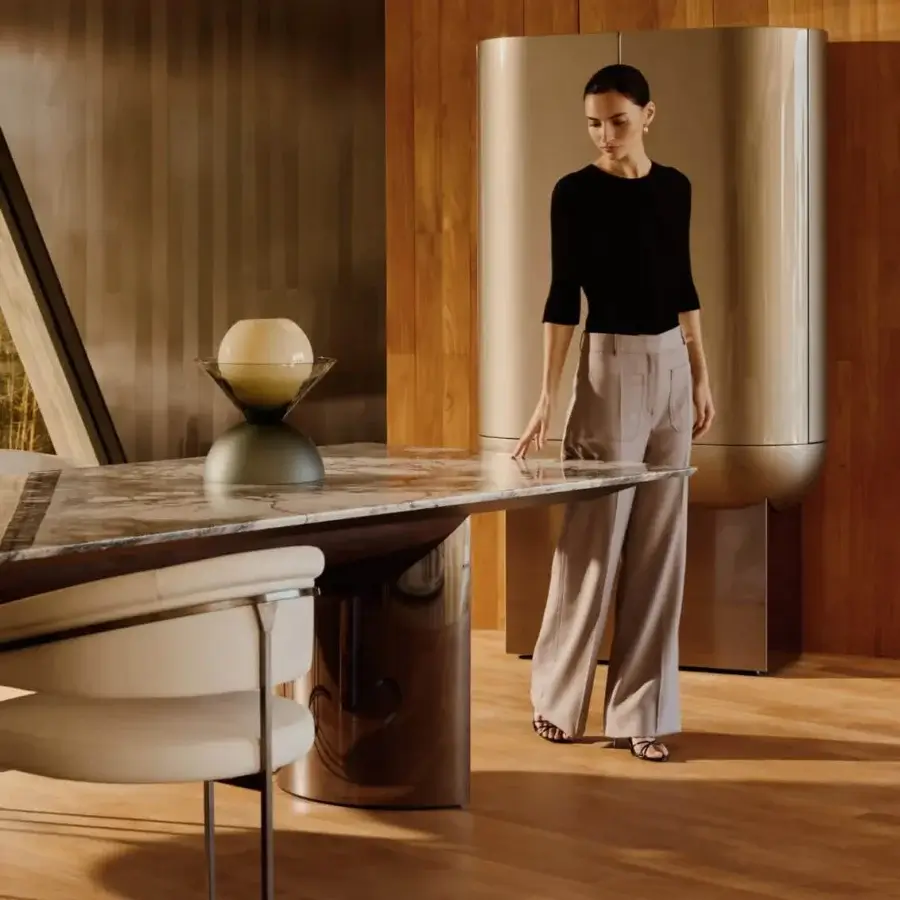 Exceptional Visionnaire Kerwan table with polished marble top and curved stainless steel base crafted in lacquered wood
