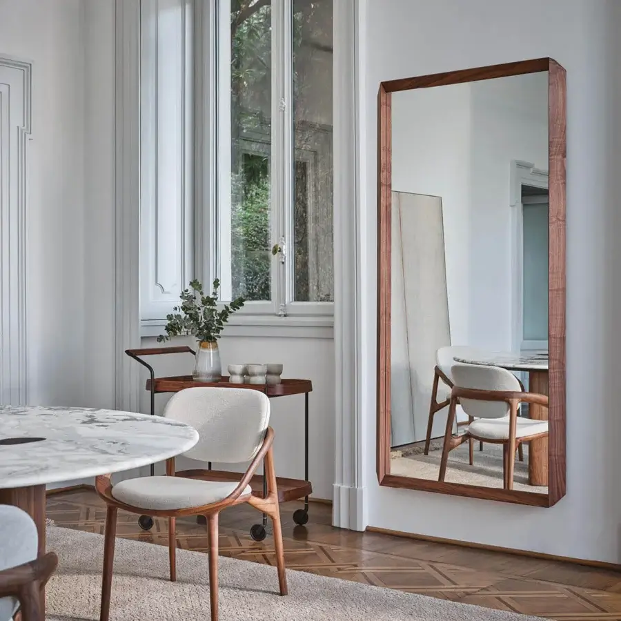 Exceptional Porada Fortyfive mirror crafted in solid canaletta walnut with a satin sheen and distinctive 45-degree corner cuts