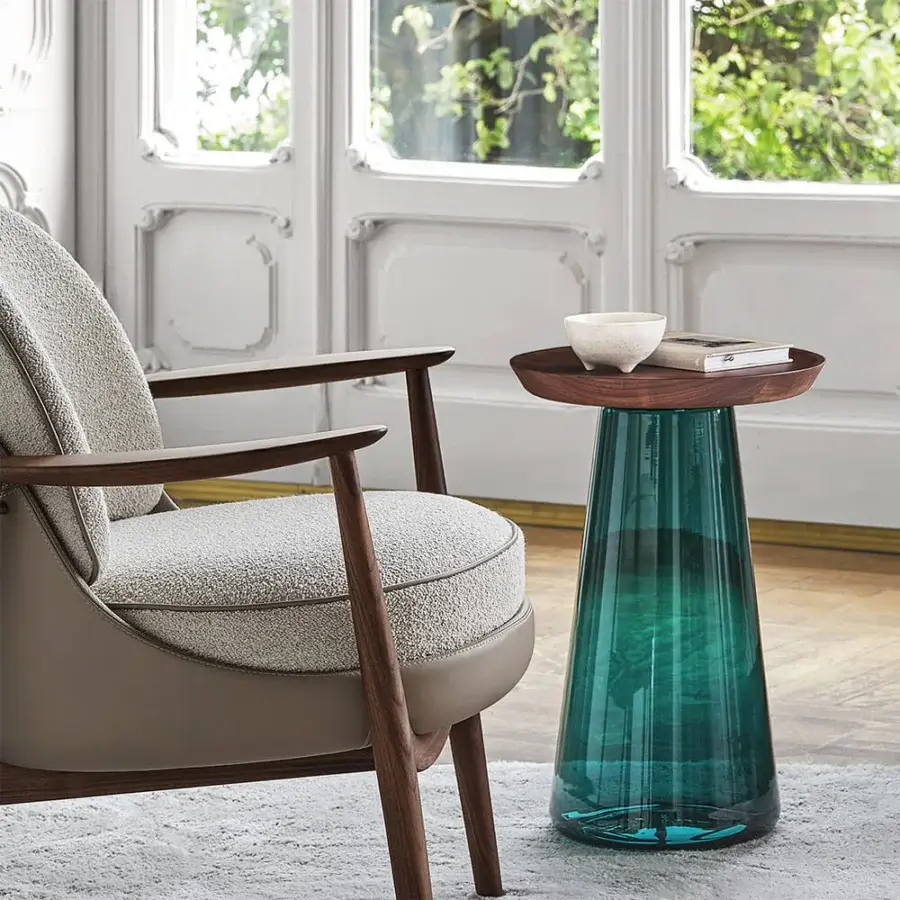 Exceptional Porada Jig side table crafted with a solid canaletta walnut tabletop and striking deep teal blown glass base
