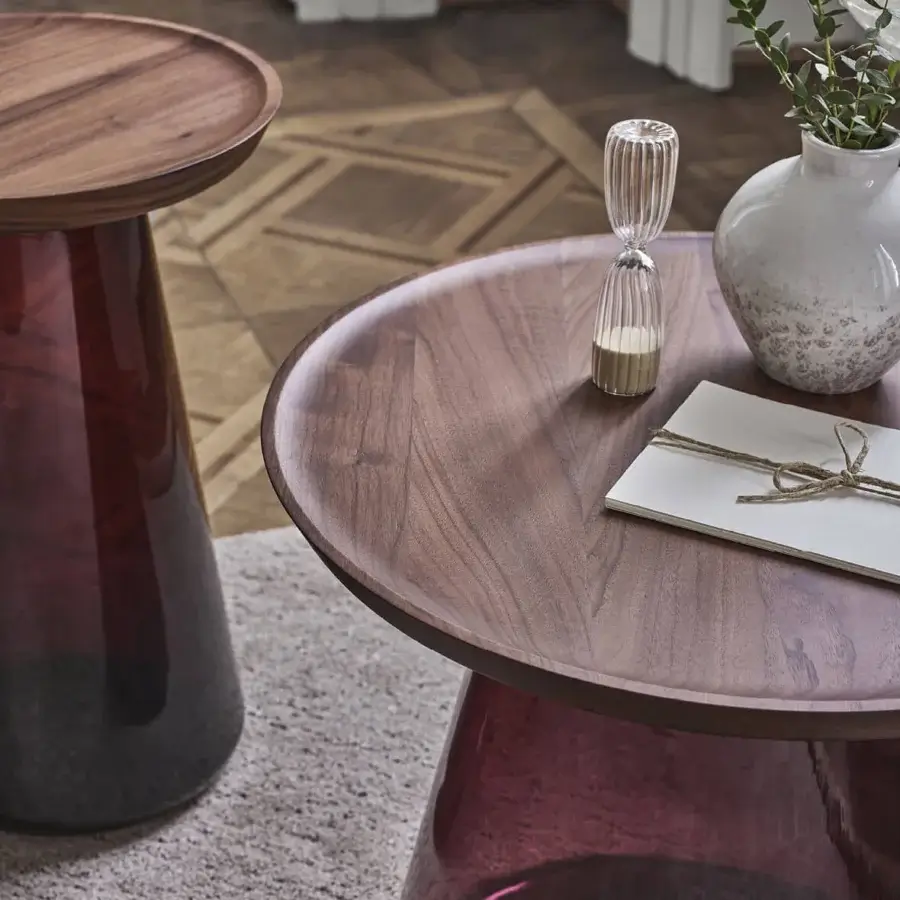 Distinguished Porada Jig side table with a solid canaletta walnut tabletop and sculpted magenta blown glass base in satin finish